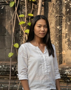 Channary, 28, Cambodian woman from Siem Reap near ancient stone wall, interested in serious international relationship