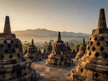 Borobudur Buddhist temple in Java Indonesia at golden sunrise, representing Indonesia's rich cultural heritage for dating connections