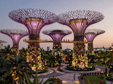 Singapore Gardens by the Bay Supertree Grove at dusk with purple and gold lighting, representing romantic Singapore dating atmosphere