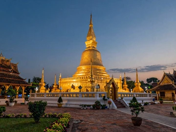 Golden Pha That Luang stupa in Vientiane Laos at sunset, the most important national monument representing Lao Buddhist heritage and cultural pride