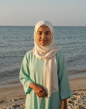 Haziqah, 25, Bruneian woman from Muara at tropical beach in mint green tunic, looking for meaningful partnership