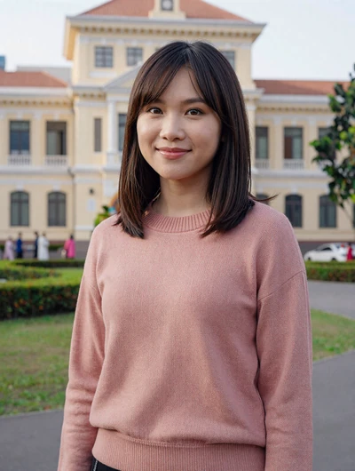 Vy, 28, Vietnamese woman from Hai Phong in park with colonial architecture, seeking lifelong partner