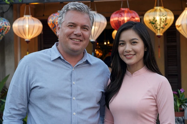 Robert and Linh, American-Vietnamese couple celebrating at Hoi An lantern festival, cross-cultural love story