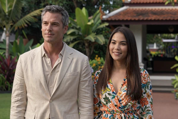 Steven and Nong, American-Thai couple at a Thai temple garden, international dating platform success