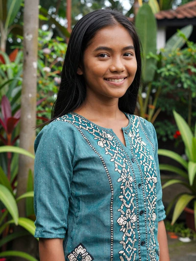 Putri, 26, Indonesian woman from Jakarta in tropical garden setting